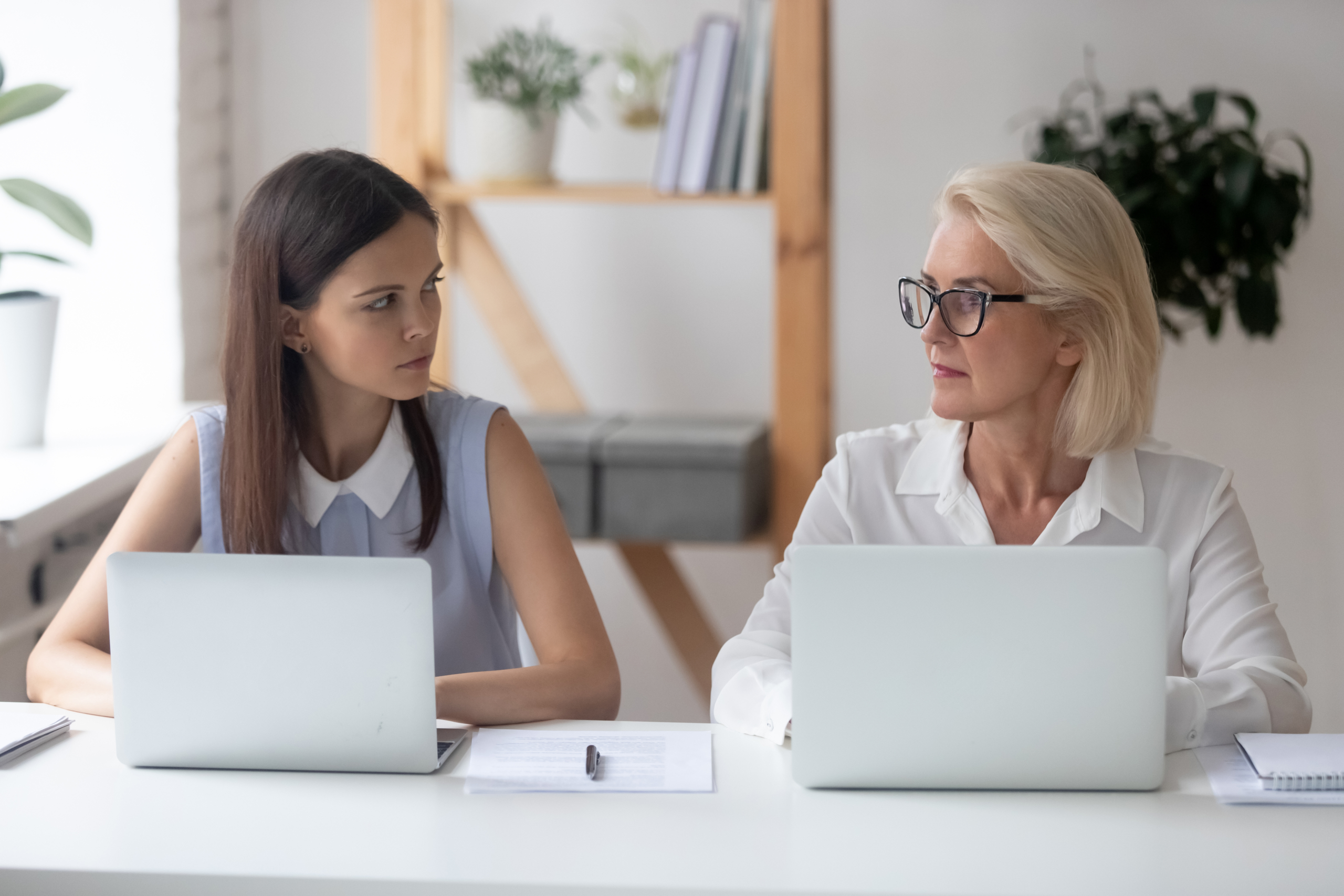 Different,Ages,Women,Colleagues,50s,And,Young,Female,Workmates,Sit